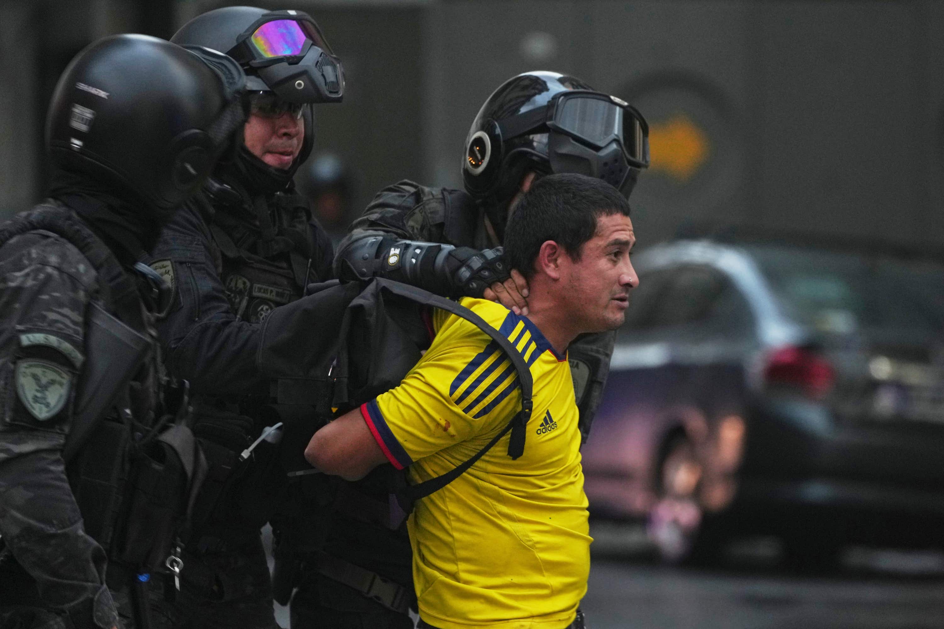 Police detain a soccer fan who joined retirees protesting for higher pensions and against austerity measures implemented by Javier Milei’s government in Buenos Aires