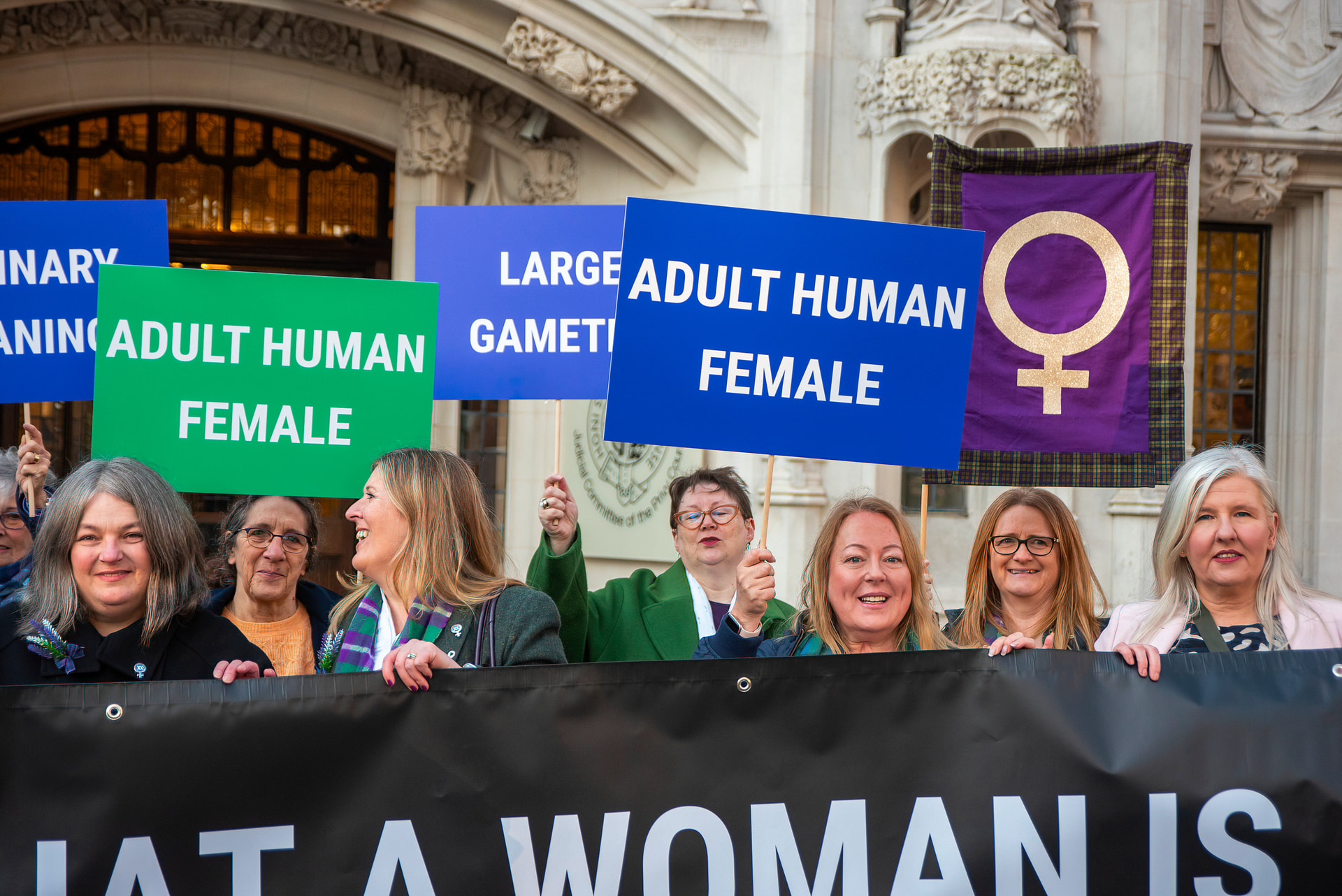 Supporters of the Sex Matters and the For Women Scotland hold a banner and placards outside the Supreme Court.