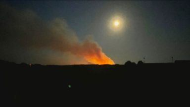 Firefighters battle large woodland wildfire for fourth day