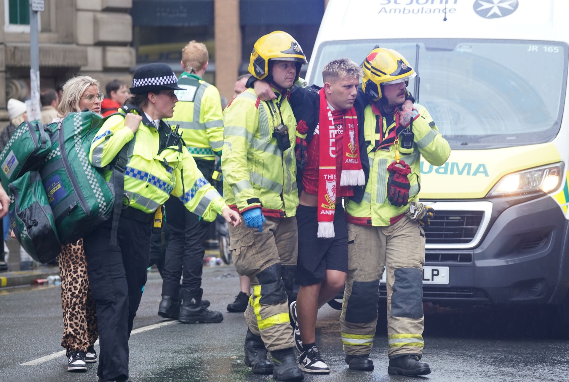 Emergency services help a fan after the incident