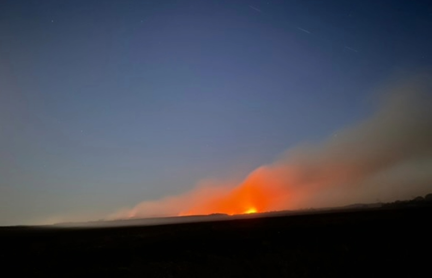 The wildfire broke out as an 'extreme' risk of wildfires was issued until Monday due to the warm, dry weather.