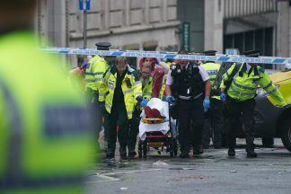 Man arrested after car ploughs into crowds of people at Liverpool victory parade