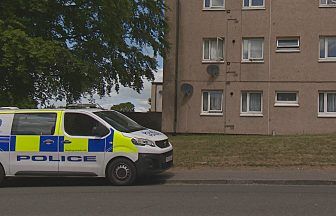Two people appear in court charged with assault after woman falls from window of Dundee flat block