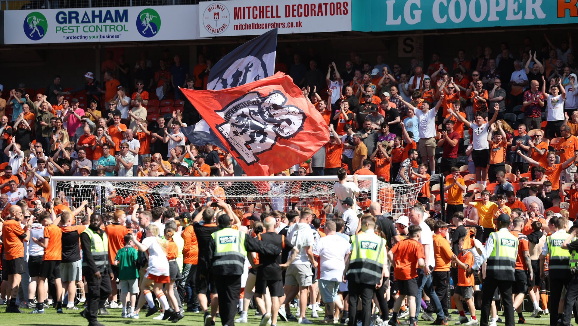 DUNDEE, SCOTLAND - MAY 17: Dundee United fans on the pitch at full time during a William Hill Premiership match between Dundee United and Aberdeen at the CalForth Construction Arena at Tannadice Park, on May 17, 2025, in Dundee, Scotland. (Photo by Roddy Scott / SNS Group)