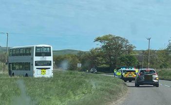 Double decker school bus veers off Aberdeenshire road due to medical incident on board