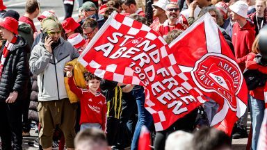 Scottish Cup winners Aberdeen parade trophy through city on open-top bus