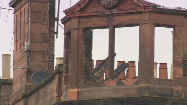 First Minister praises firefighters on visit to site of major blaze
