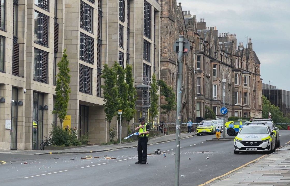 Baby taken to hospital as man arrested after armed police seal off Edinburgh roads