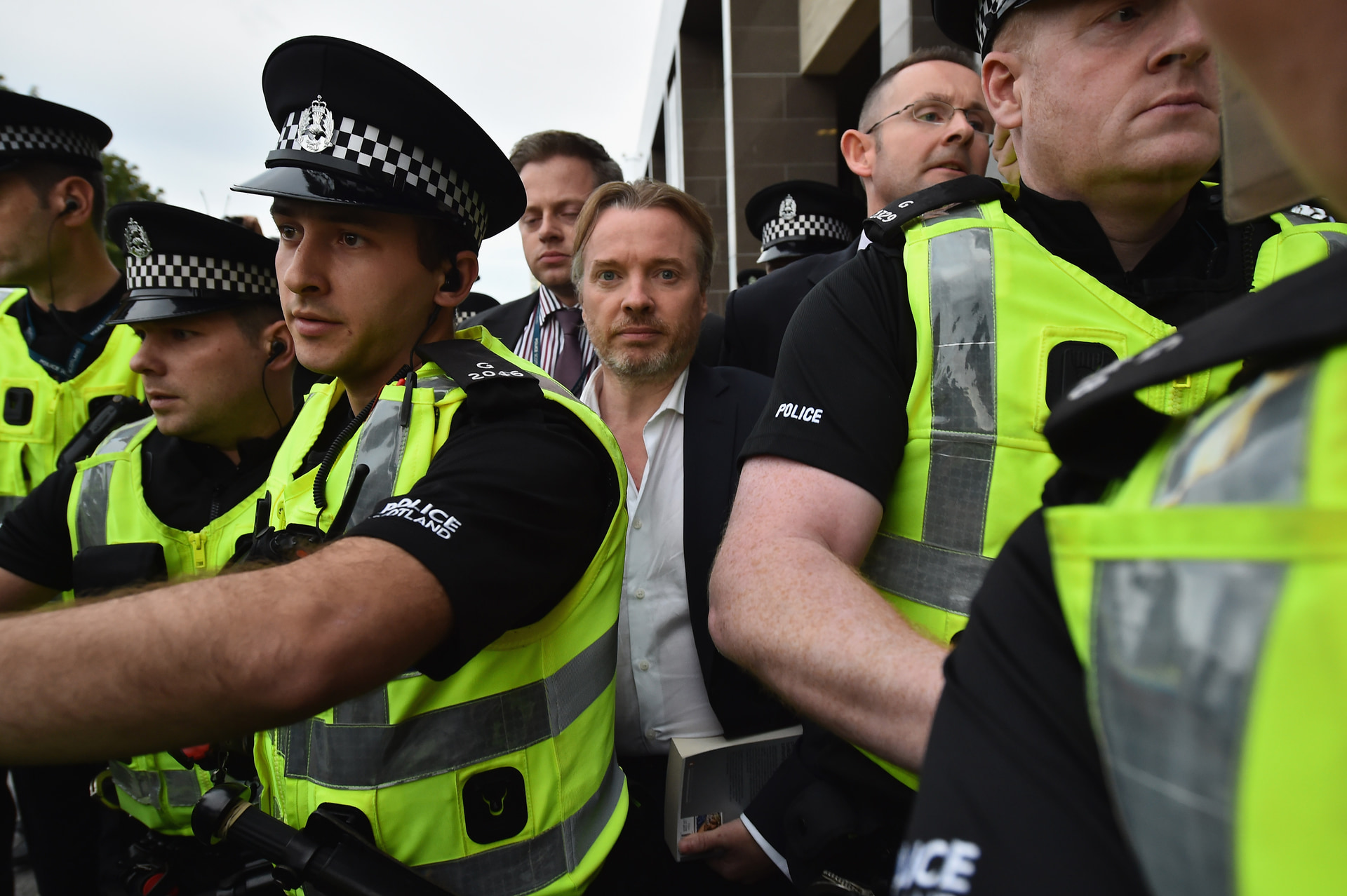 Craig Whyte leaves court surrounded by police on September 2, 2015 in Glasgow, Scotland.