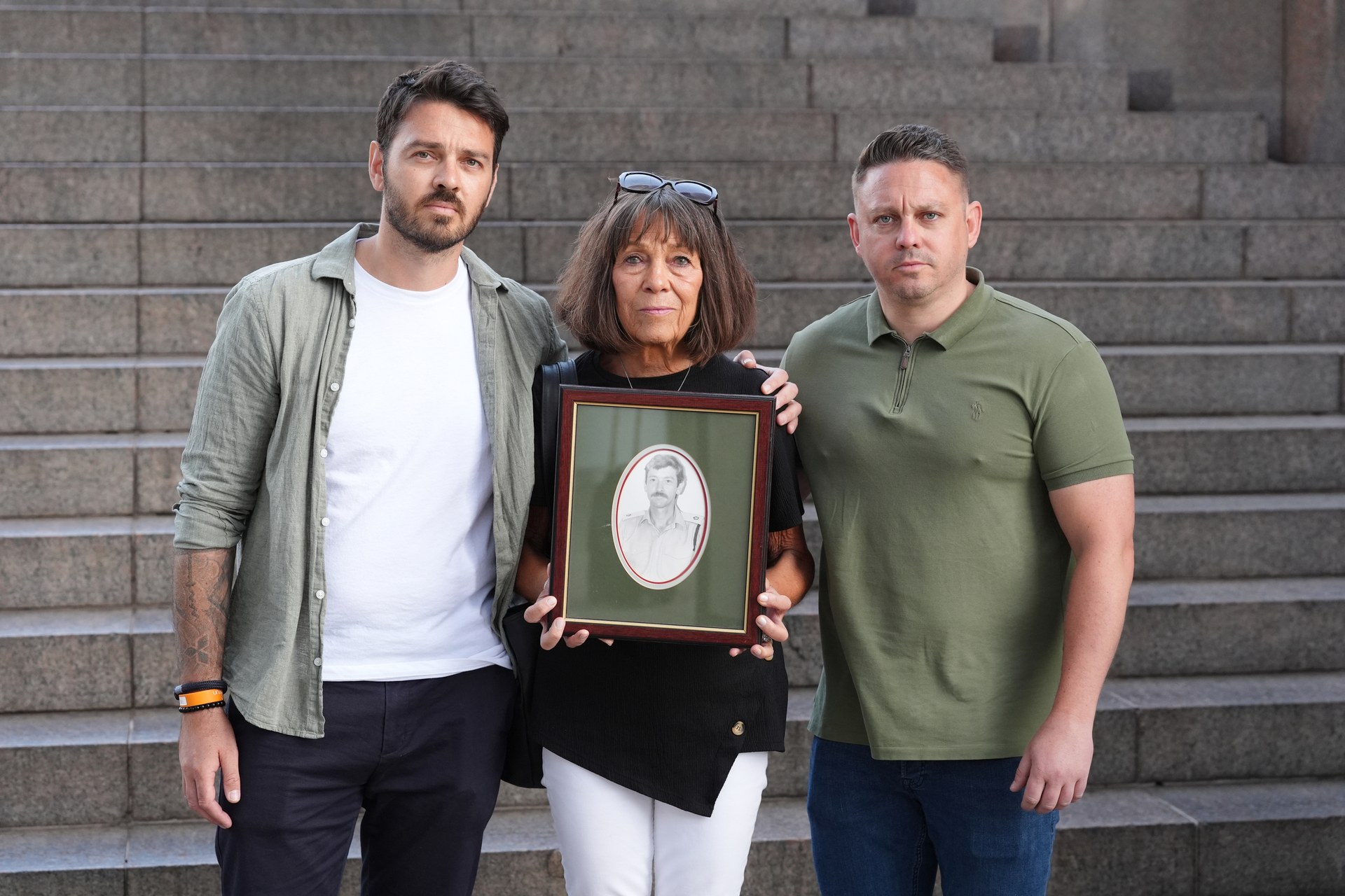 Families of those killed in the 1994 Chinook crash Andy Tobias (left), Gaynor Tobias and Matt Tobias holding a photo of lieutenant colonel John Tobias, before meeting their legal team in central London. RAF Chinook ZD576 was carrying 25 British intelligence personnel from RAF Aldergrove in Northern Ireland to a conference at Fort George near Inverness when it crashed in foggy weather on June 2, 1994. Picture date: Friday July 4, 2025.
