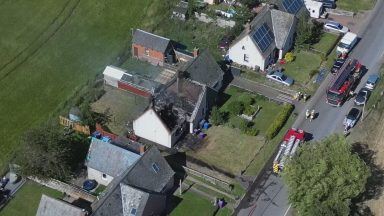 Person treated at scene after major house fire breaks out in Angus