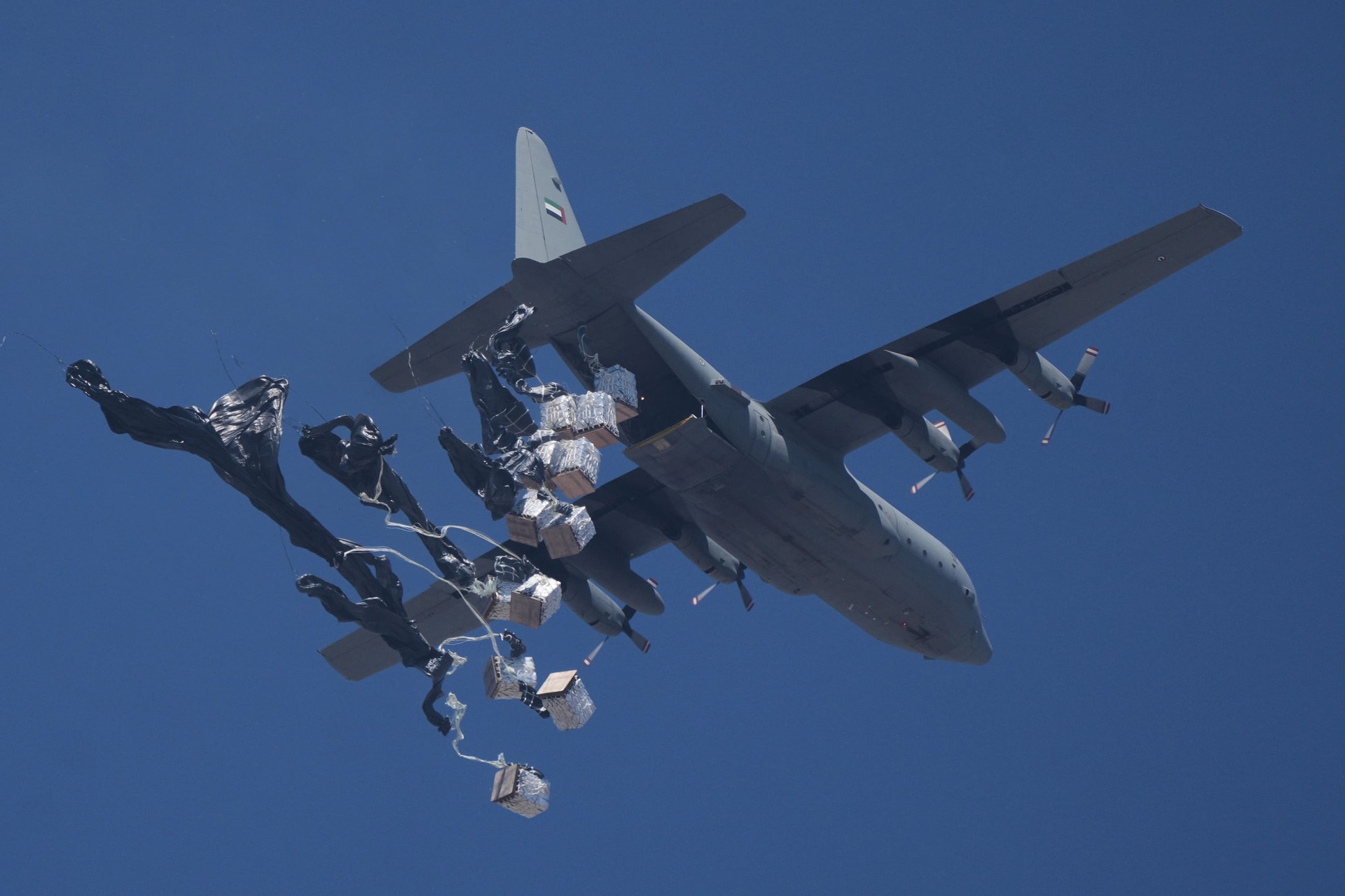 Humanitarian aid is airdropped to Palestinians over Gaza City, Gaza Strip (Jehad Alshrafi/AP).