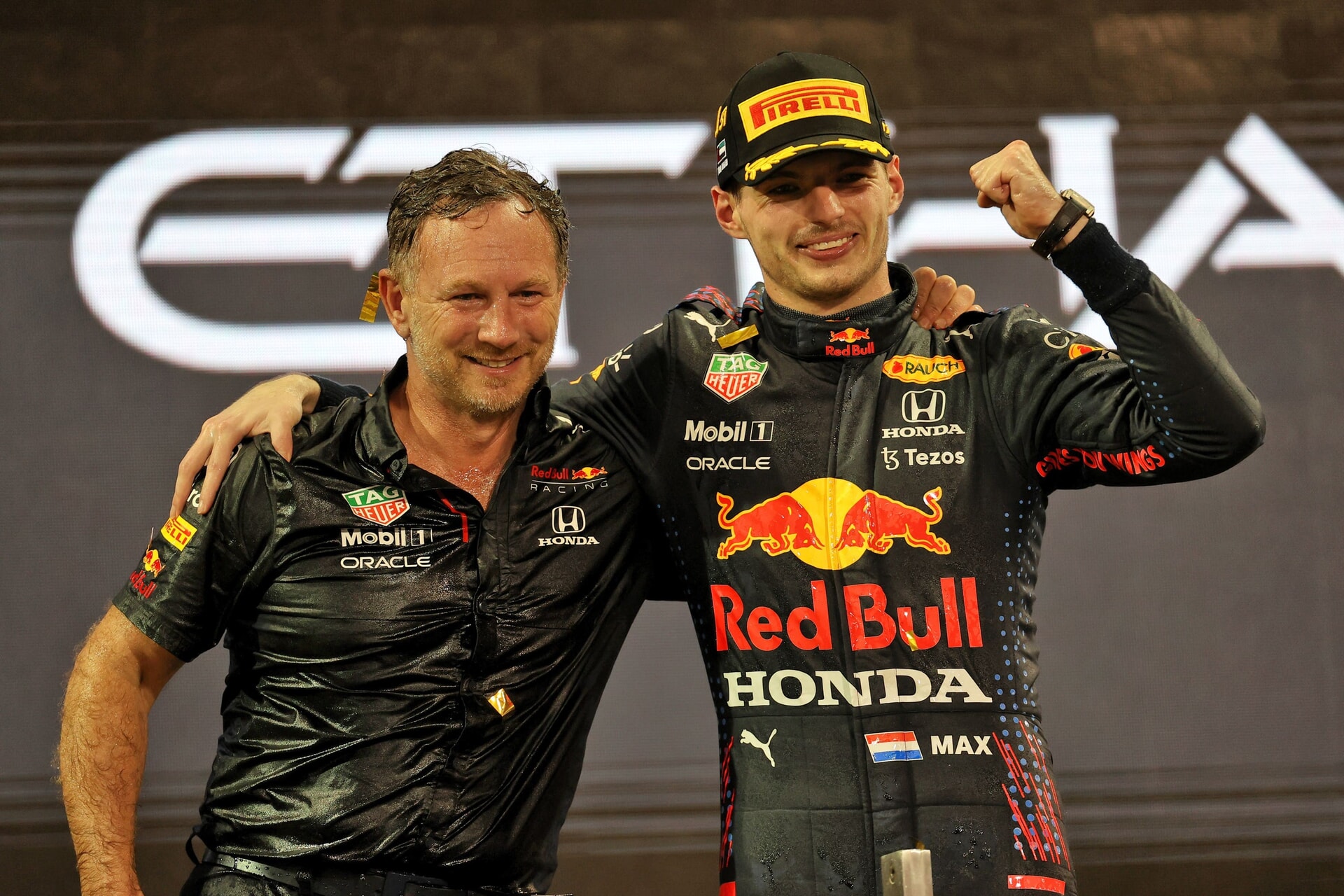 Max Verstappen (right) celebrates alongside Horner after winning his first world title in December 2021
