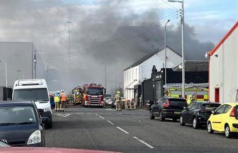 Firefighters battle blaze in building at Glasgow industrial estate 