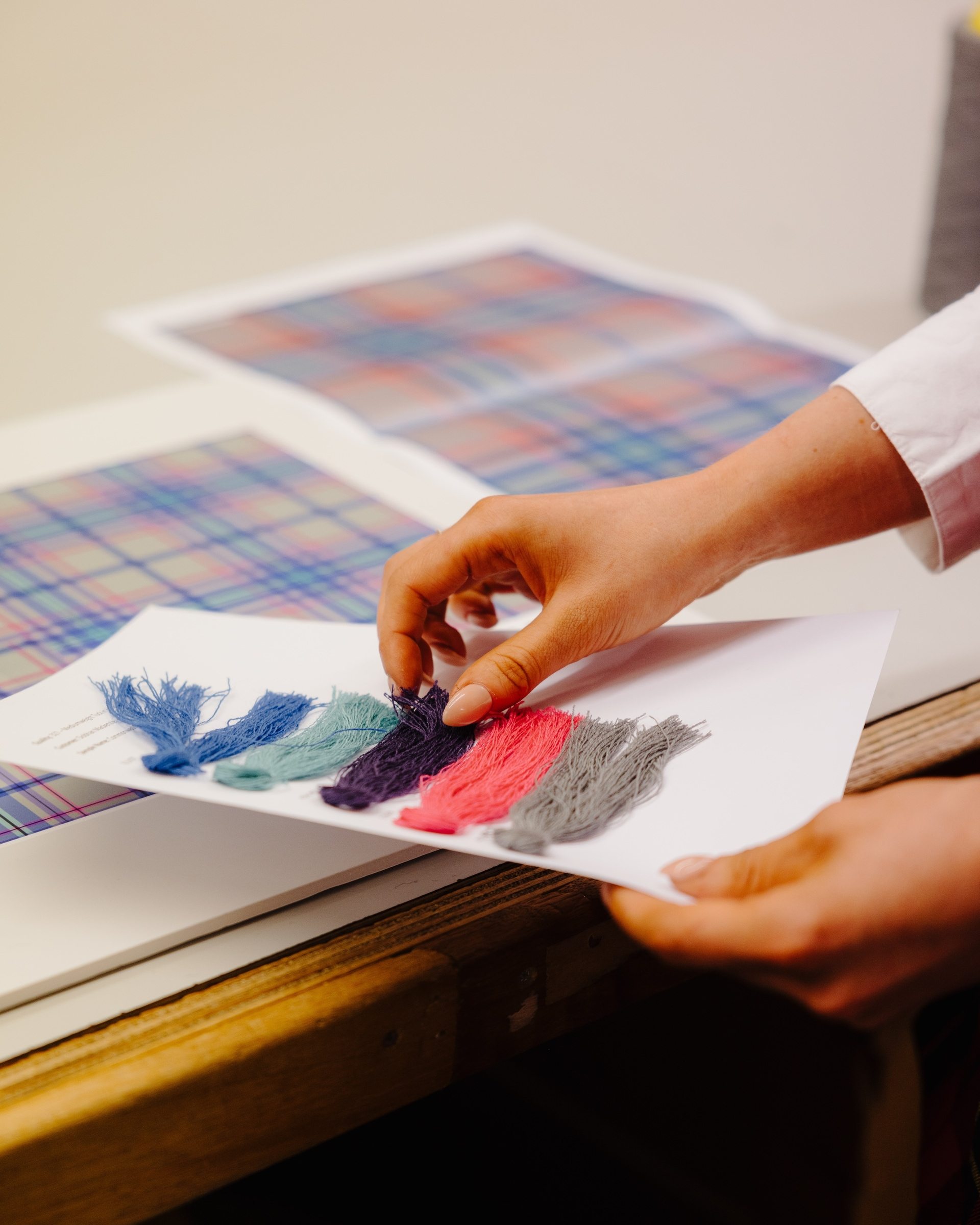 Siobhan Mackenzie selects yarn for the Glasgow 2026 official tartan