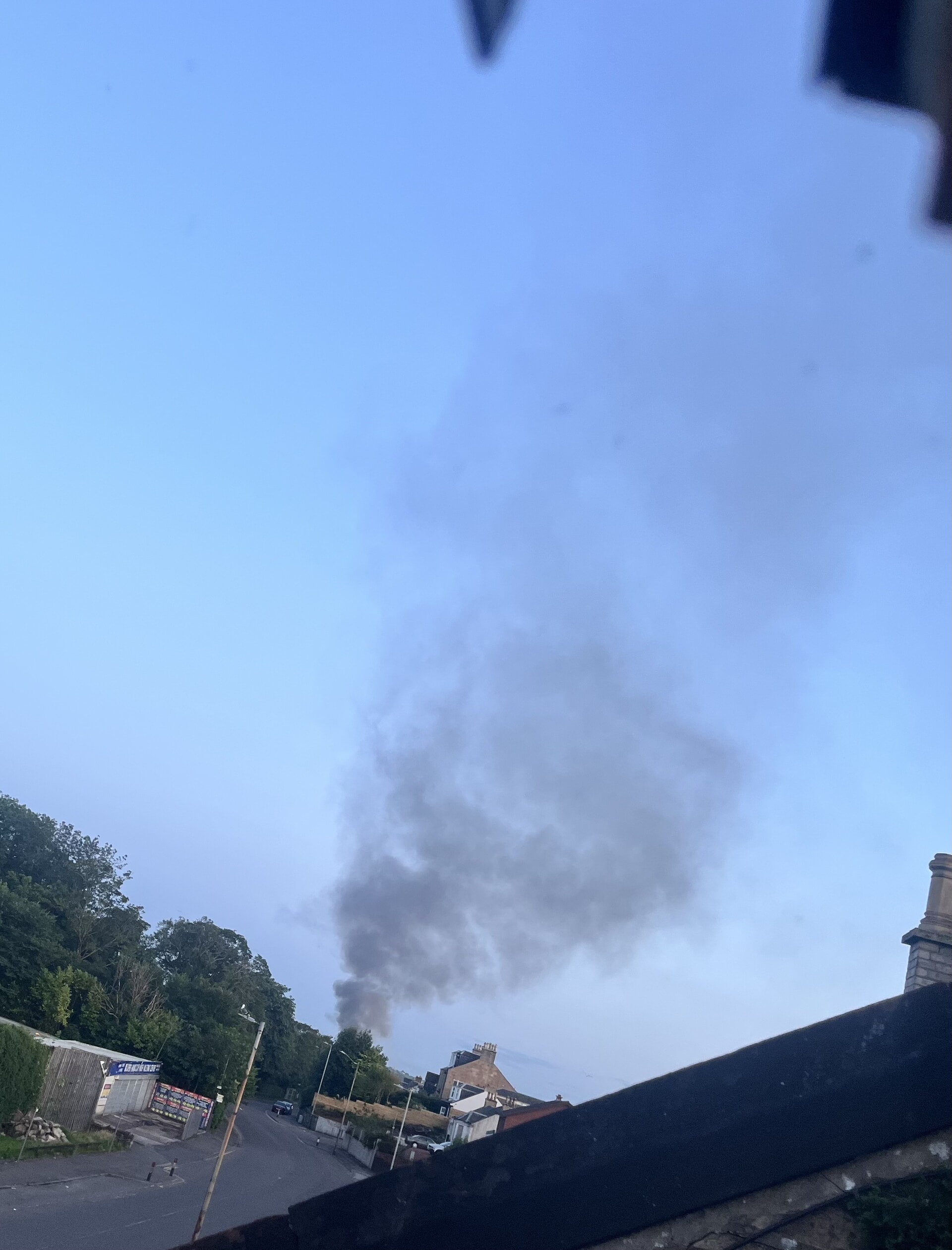 Thick smoke is billowing into the sky over the town.