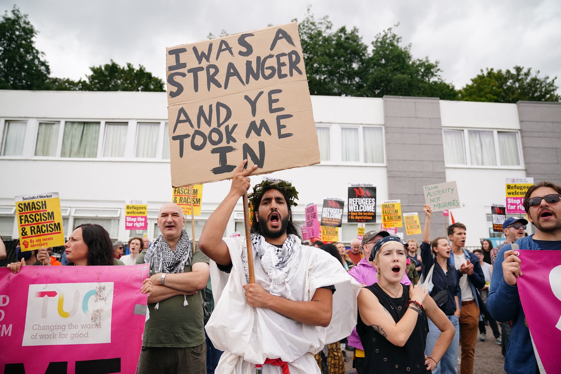 Protesters for and against asylum seekers gathered in Falkirk, Scotland (Jane Barlow/PA).