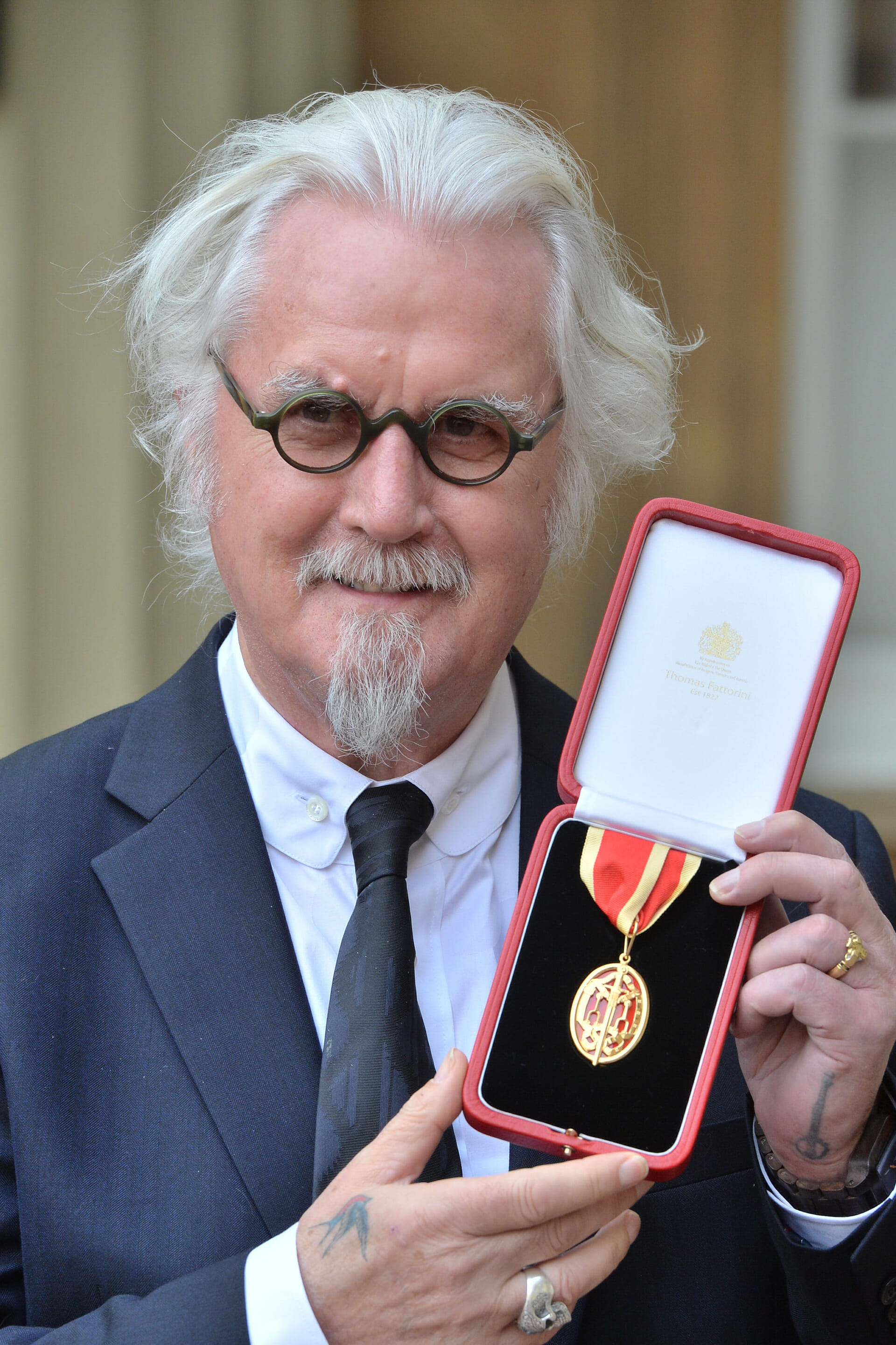 Sir Billy Connolly after being knighted by the Duke of Cambridge during an Investiture ceremony at Buckingham Palace, London.