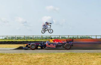 BMX rider jumps over speeding F1 car in ‘scariest stunt yet’