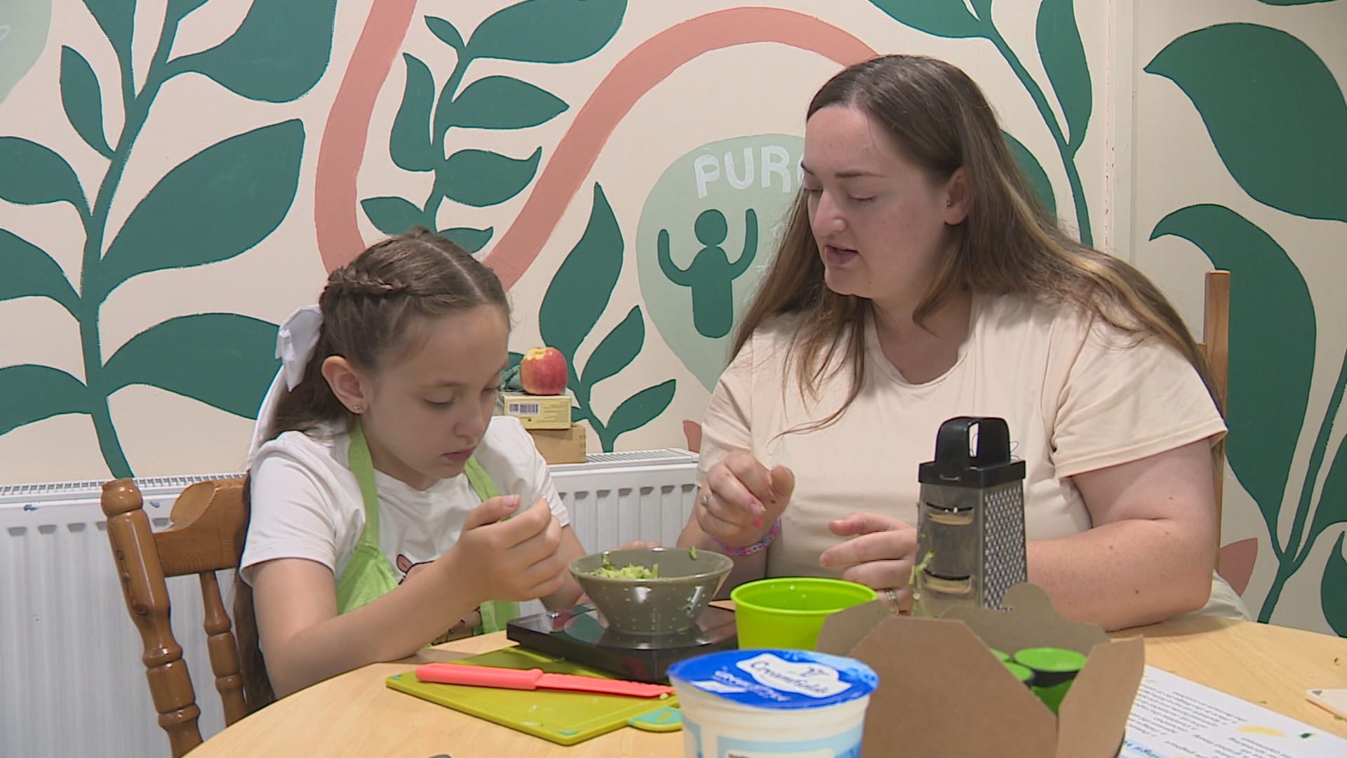 Mum Brogan Blann with Isla making tzatziki together