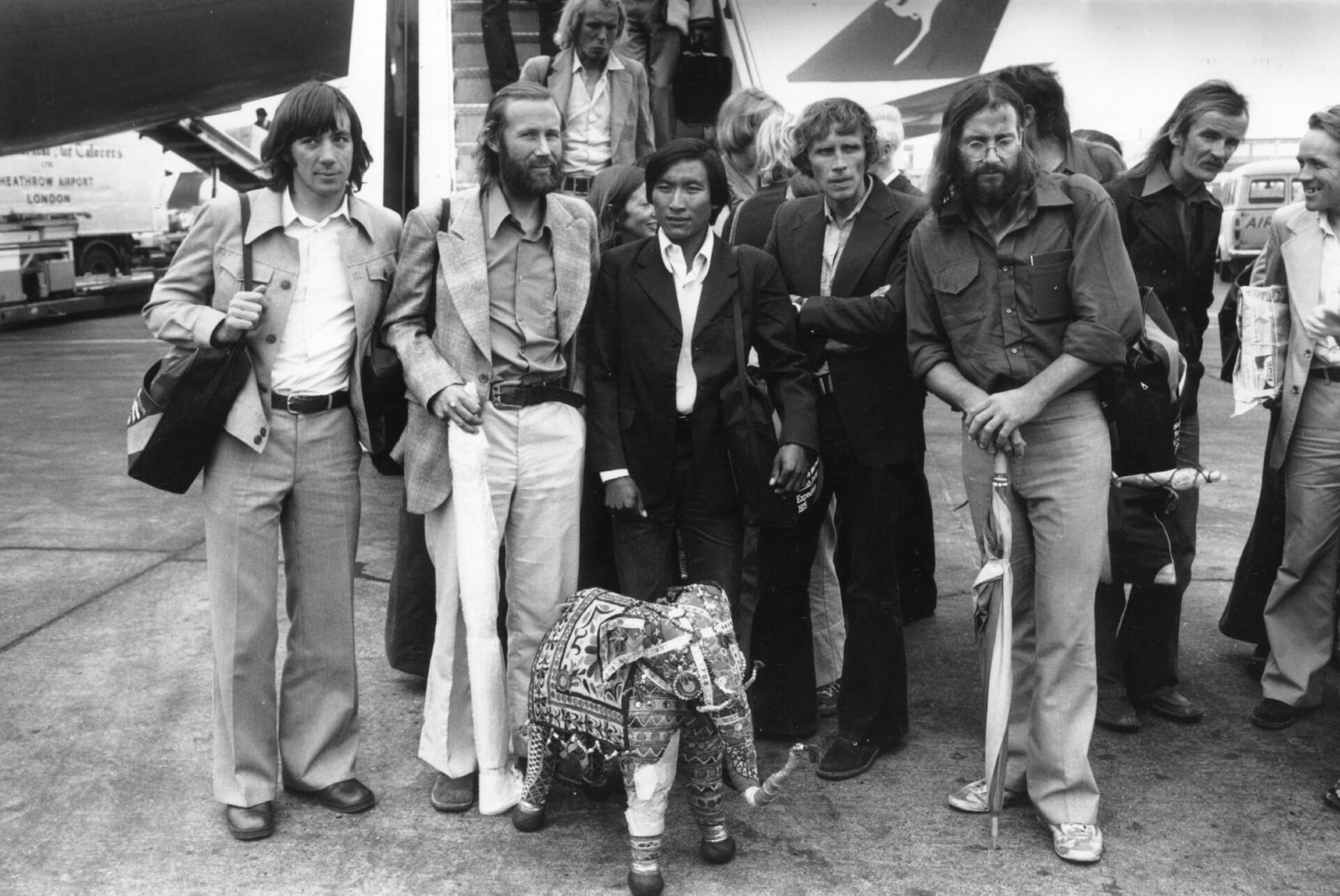 17th October 1975:  Chris Bonington, second from left, and other members of the successful 1975 expedition to climb the South West Face of Everest, at Heathrow Airport.