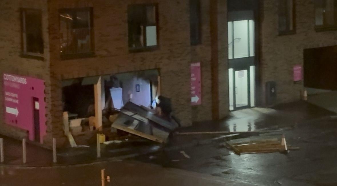 A person seen at the showroom damaged by Storm Amy
