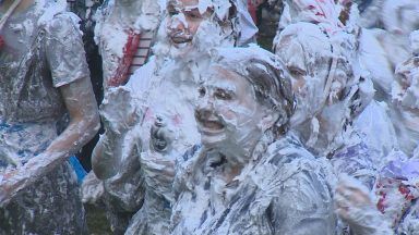 St Andrews students celebrate Raisin Monday with foam fight