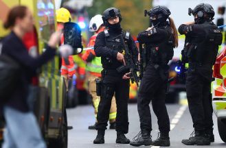 Two dead and suspect shot after suspected terror attack at Manchester synagogue