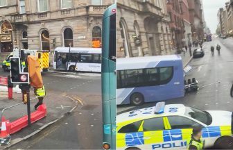 Driver in hospital after bus crashes into building on George Square in Glasgow