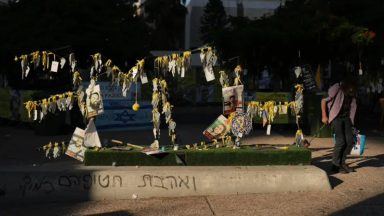 Israel to halve aid into Gaza over slow return of dead hostages
