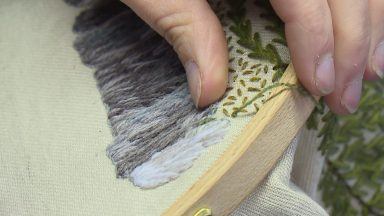 Community battling for survival creates tapestry celebrating local life