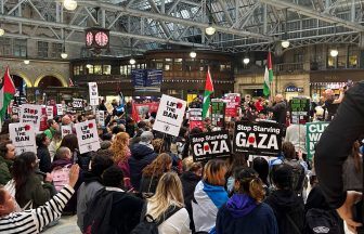 Hundreds of pro-Palestinian protesters gather at Glasgow and Edinburgh train stations