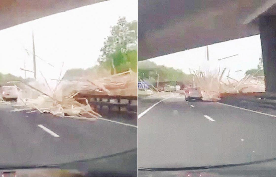 Tractor driver dies after trailer load of timber crashes onto motorway in Glasgow