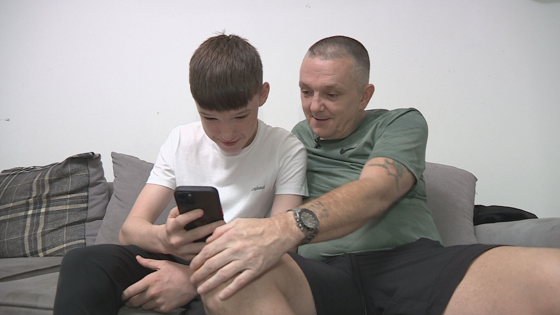 John's dad and brother look back on old photos