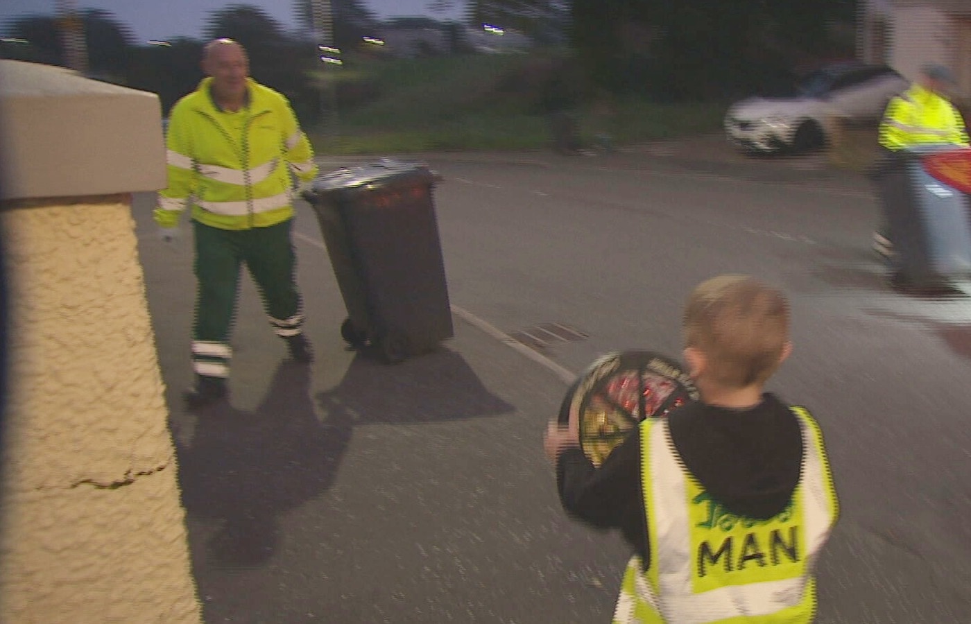 Jaxx with his local binmen in Greenock