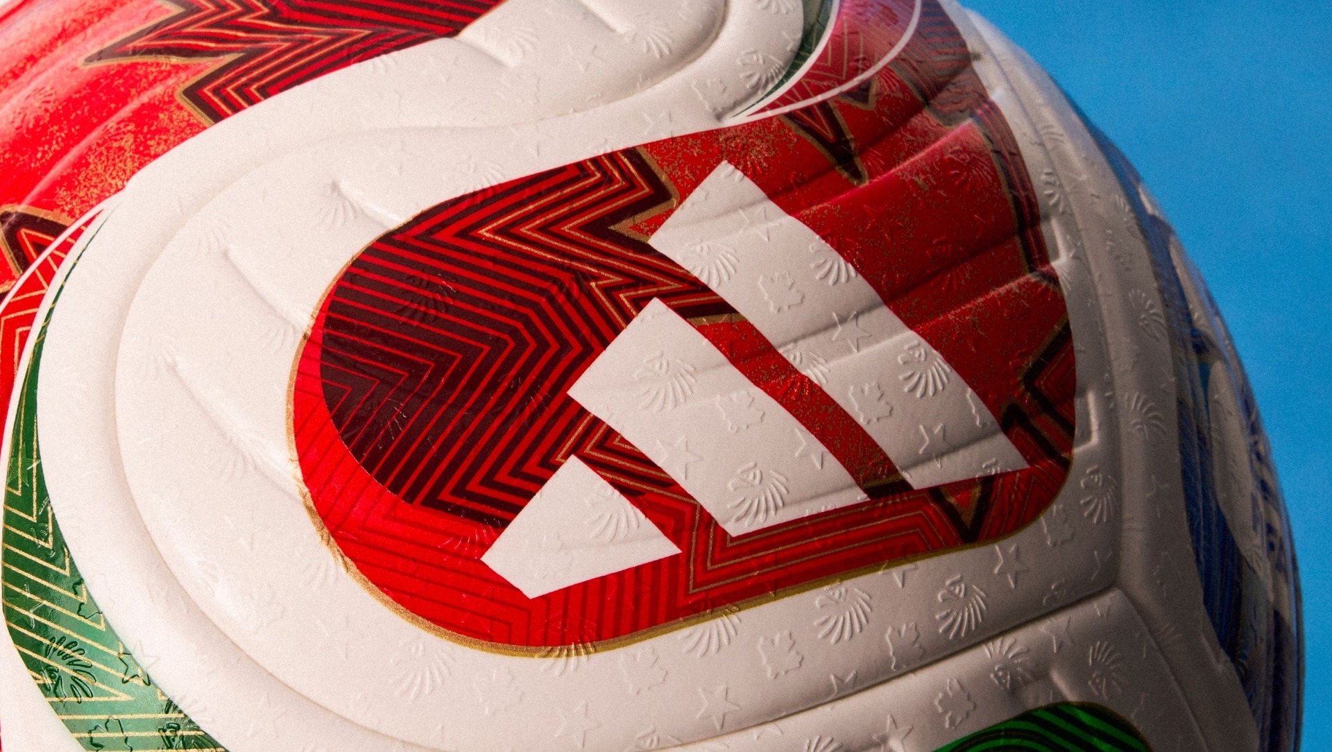 The panels of the Trionda ball are embossed with icons to represent the three World Cup host nations.