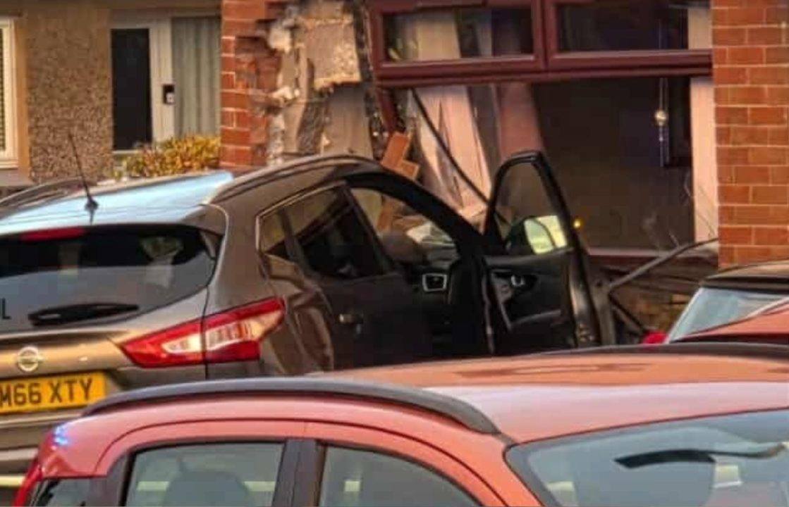 Woman, 81, and driver taken to hospital after car crashes into house