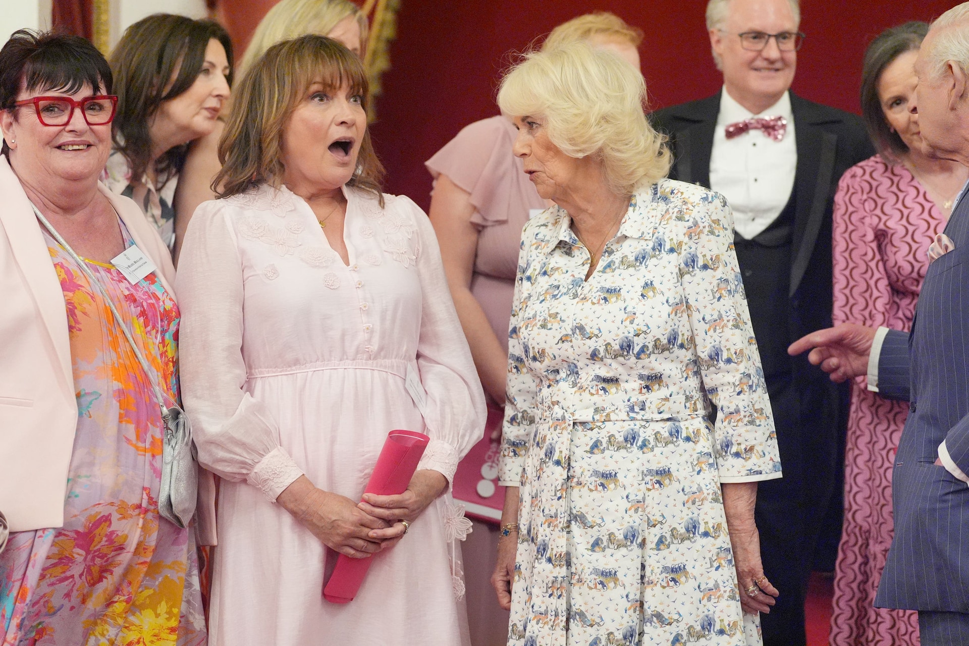 Lorraine Kelly laughs with the Queen during a reception in Buckingham Palace earlier this year (PA).