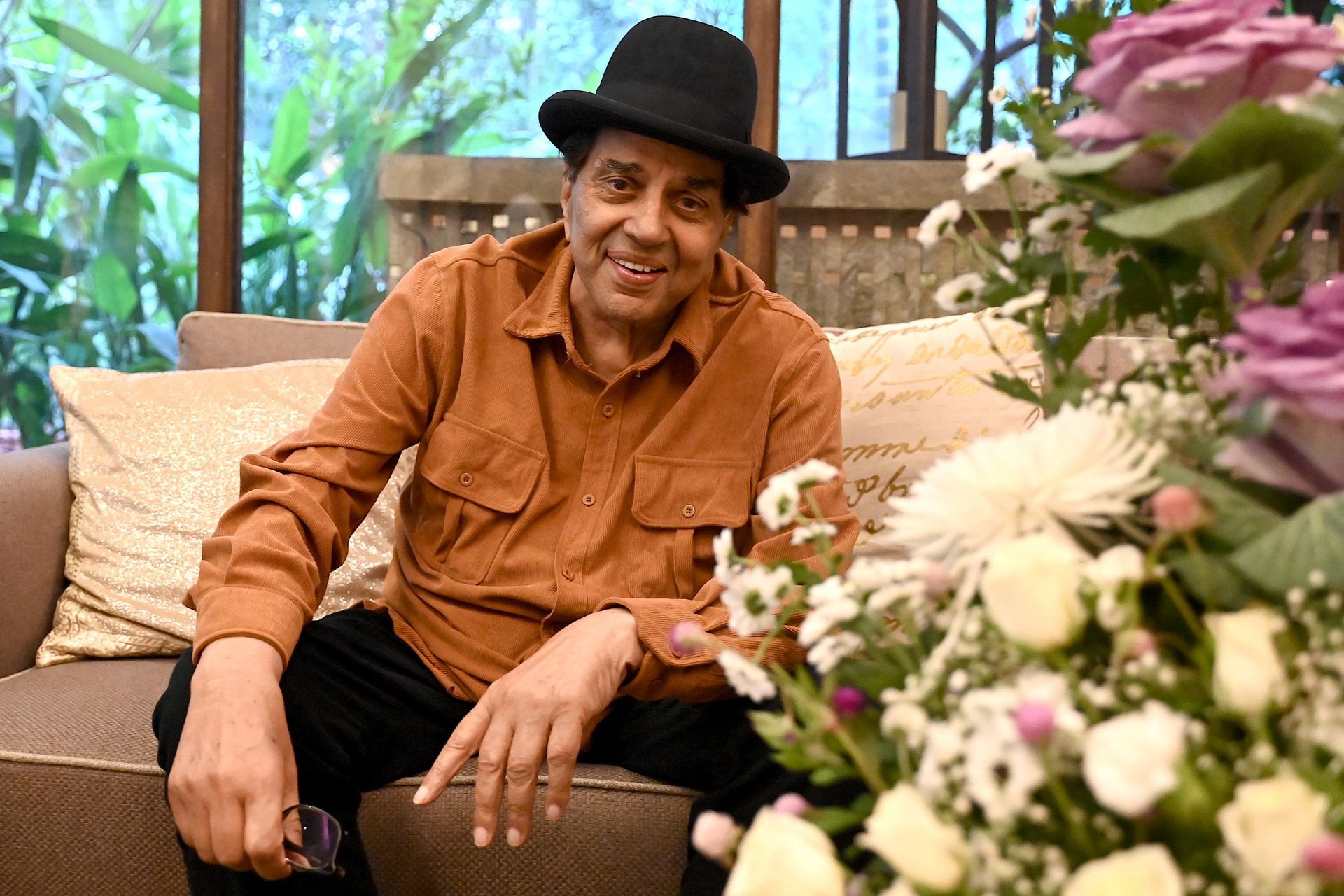 Bollywood actor Dharmendra poses on his 88th birthday at his home in Mumbai on December 8, 2023.