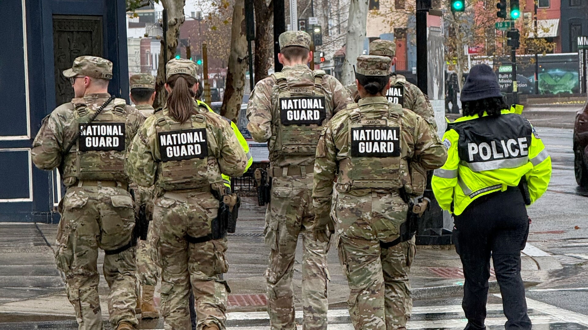 Members of the National Guard and an officer from the Washington Metropolitan Police Department on foot patrols in Washington.