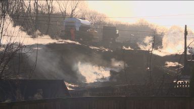 Underground coal fire covering homes in layers of soot