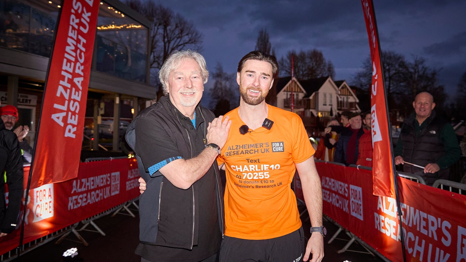 Charlie Quirke and his father Steve Sheen after he crossed the finish line.