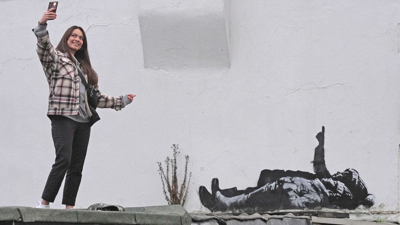 Banksy claims Bayswater artwork that shows two figures lying down
