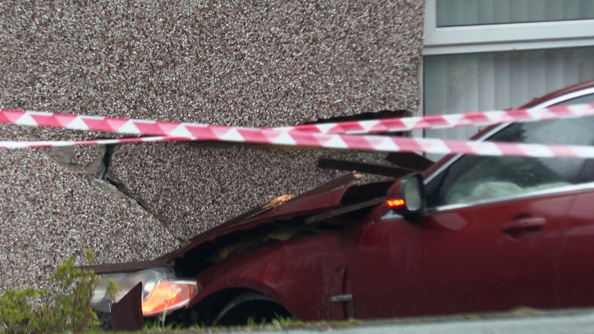 A car has caused significant damage to the house.