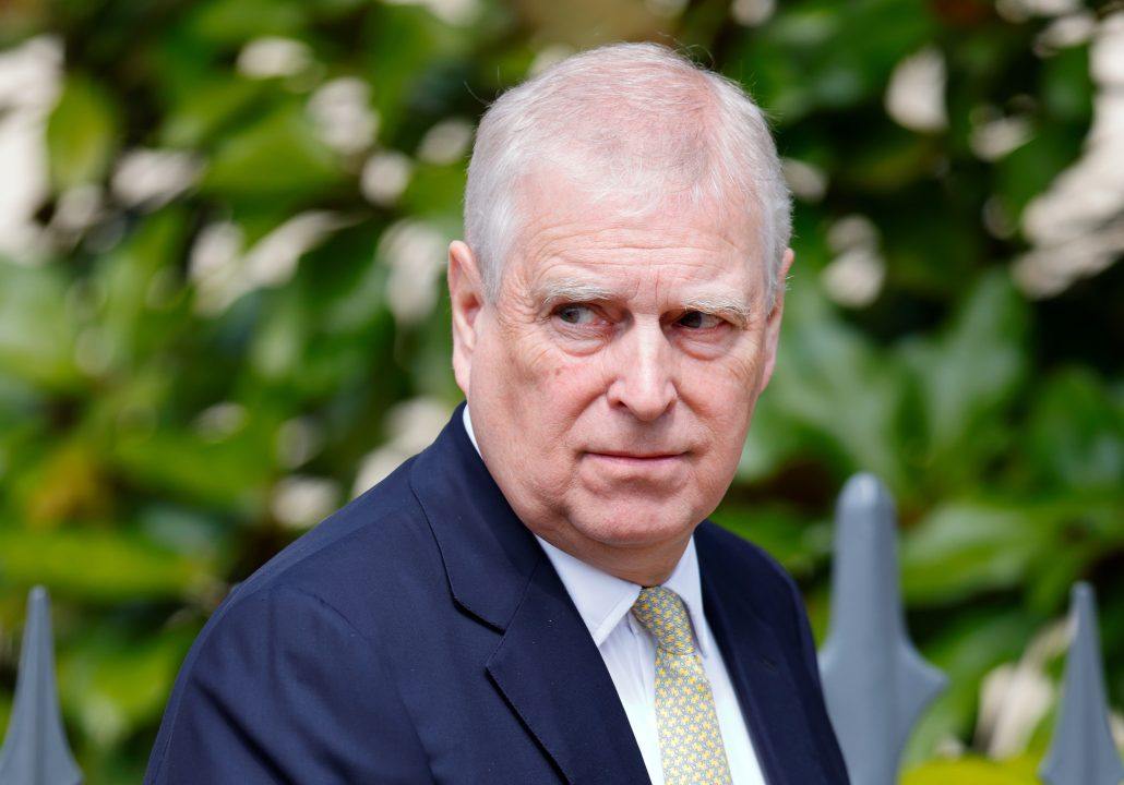 Epstein files appear to show former Prince Andrew crouched over unidentified woman
