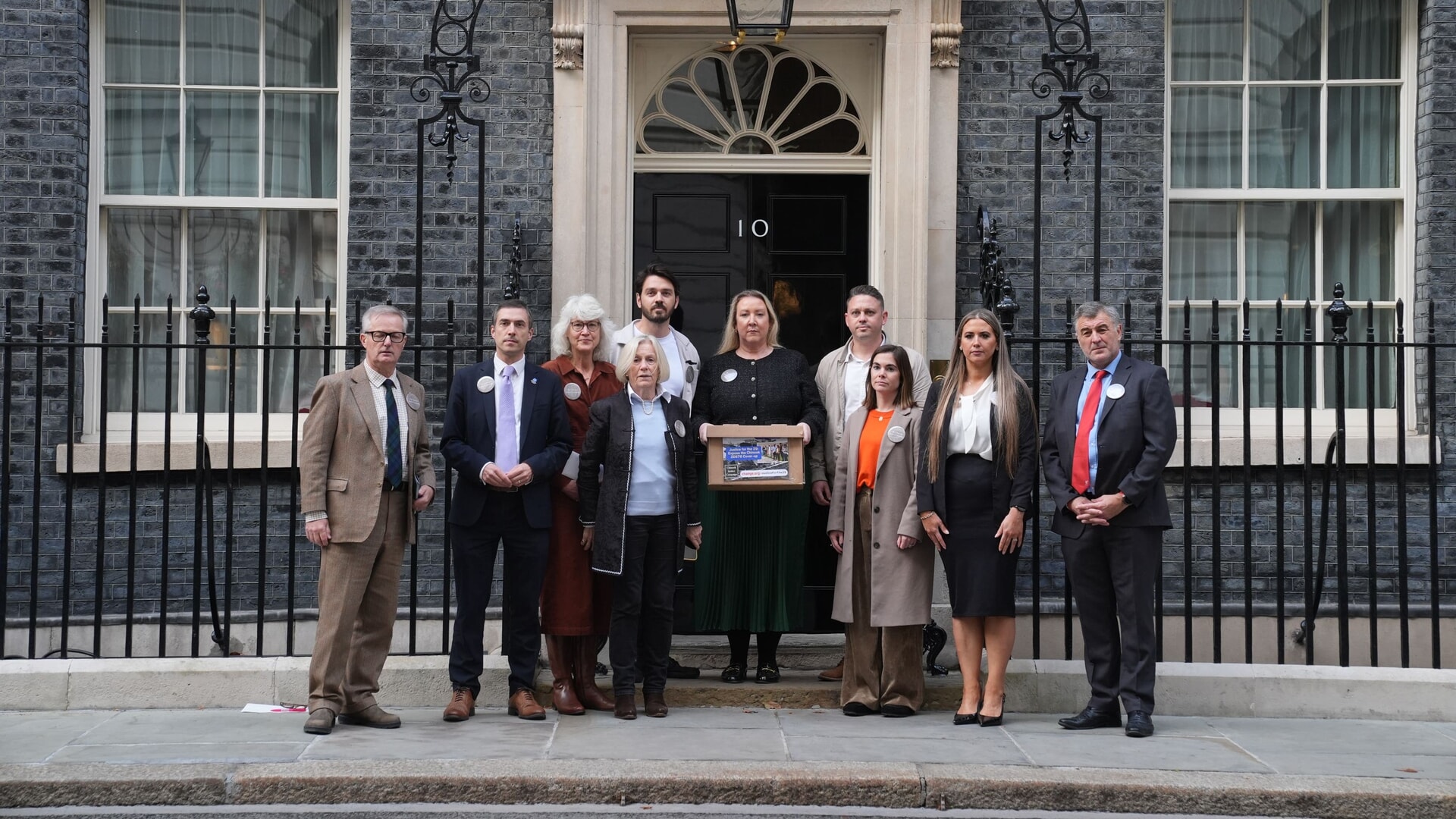 Family members of victims of the 1994 Chinook crash prior to handing in a petition to 10 Downing Street.