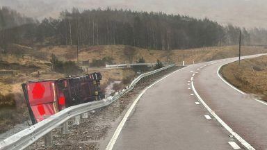 Lorry overturns after crash and trees block railway as Storm Chandra hits Scotland
