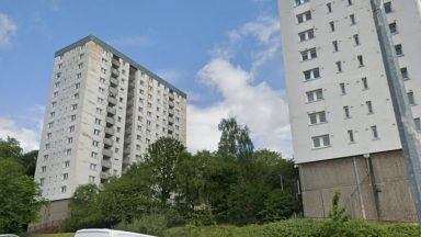 Police hunting for hat and shoes missing from body of man found dead at Dundee flat block