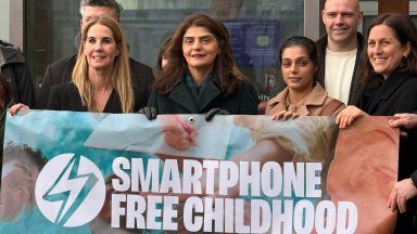 Ban phones in schools to protect children from online dangers, parents urge