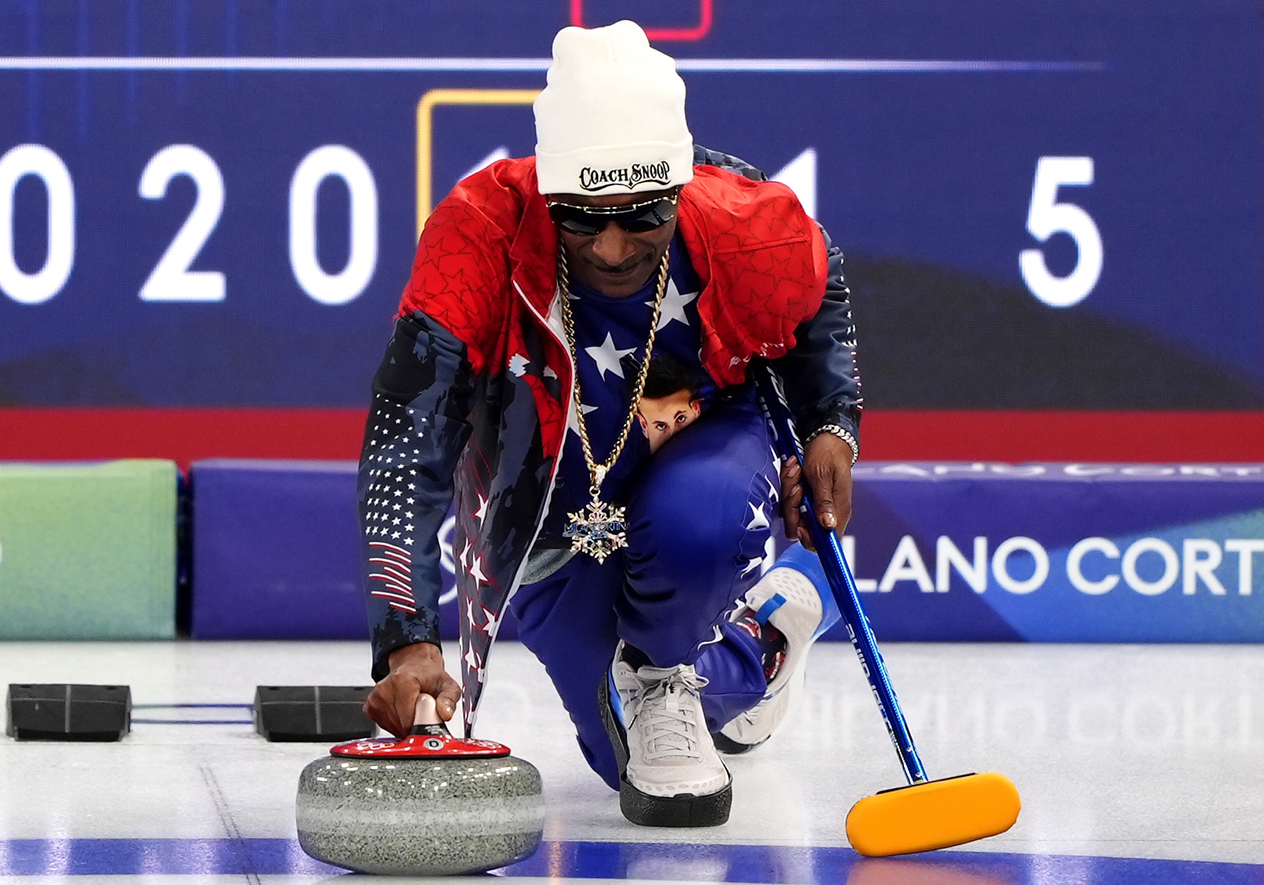 American rapper Snoop Dogg practices curling with the USA Curling team at the Cortina Curling Olympic Stadium, Italy. Picture date: Friday February 6, 2026.